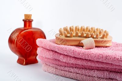 Towels, fragrance bottle and wood brush Towels, fragrance bottle and wood brush