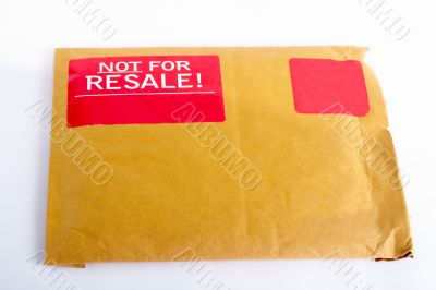 Envelope with red sticker: Not for resale
