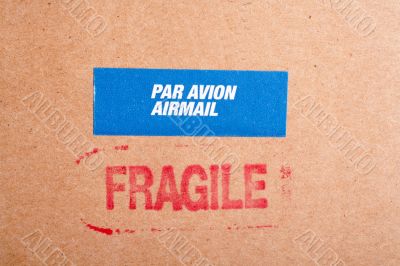 Fragile on cardboard box, and sticker Fragile on cardboard box, and sticker