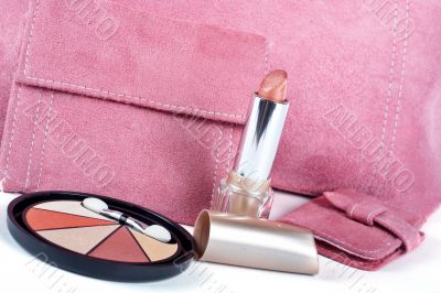 lipstick and Assortment of pink handbags