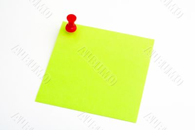 Isolated green paper with red pushnail