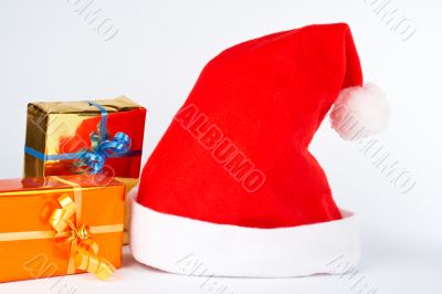 Detail of christmas hat and two gifts