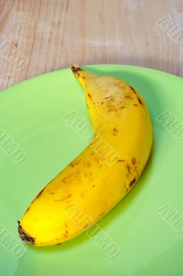 Banana on green plate