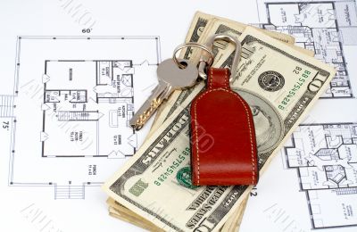 Key and money on home plan