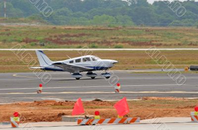 Blue and White Plane Landing