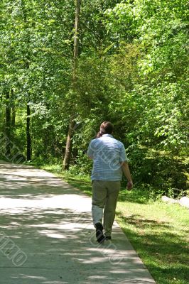 Man in Woods on Cell Phone