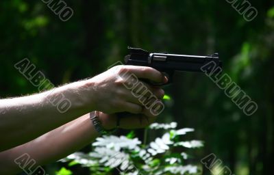 Pistol in a hand
