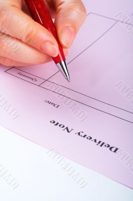 Writing blank delivery note with pen Writing blank delivery note with pen
