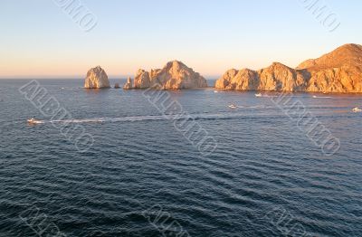 fishing Boats Past Rocks