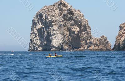 Kayak Past Rocks