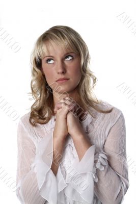 blond young woman praying