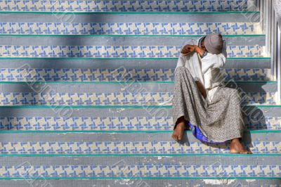Indian Muslim on stairs Indian Muslim on stairs
