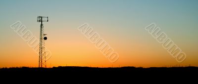 Pale Blue Cell Phone Tower Sunset