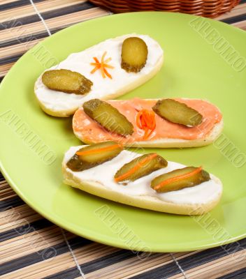 Three canapes on a porcelain plate