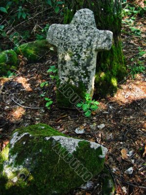 Ancient cross and stone