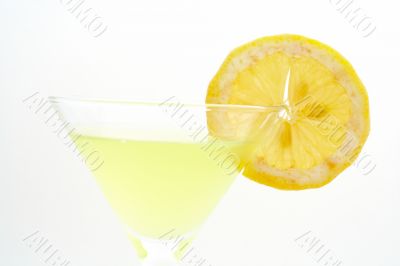 Detail of green cocktail with lemon