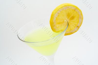 Detail of green cocktail with lemon