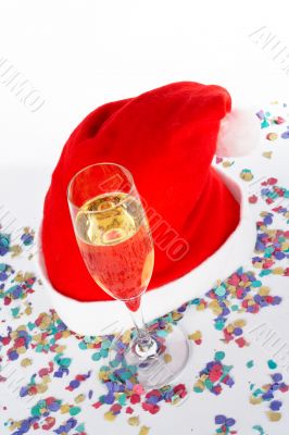 Champagne glass and christmas hat with ribbons