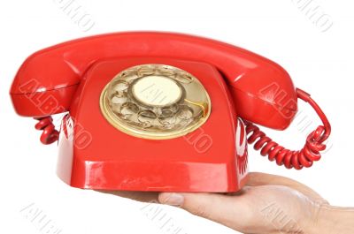 hand holding red telephone