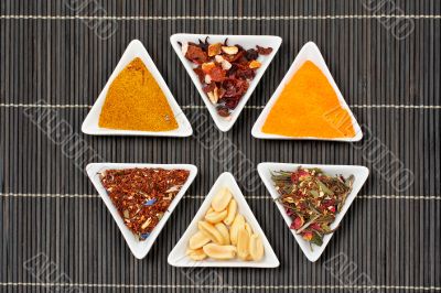 Assortment of spices over a bamboo mat