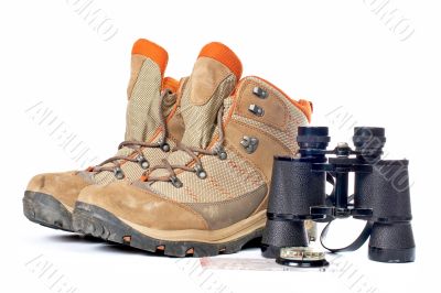Hiking boots, compass and binoculars