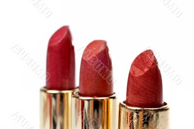 Three tubes of red lipstick