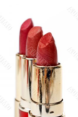 Three tubes of red lipstick Three tubes of red lipstick