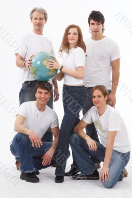 five people with a globe