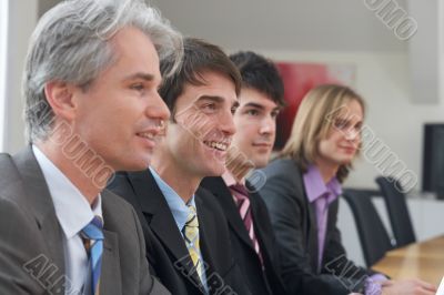 four men at a seminar