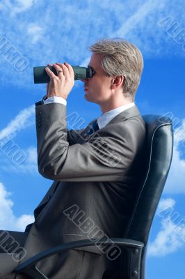 the businessman, field-glasses, future in the sky
