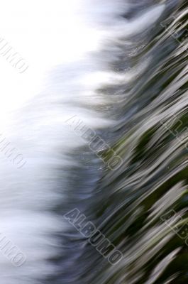 Rushing water over weir