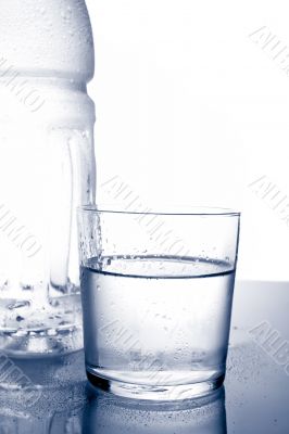 Detail of bottle and glass of mineral water