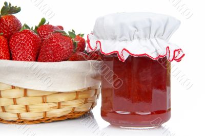 Jam jar and basket of strawberries