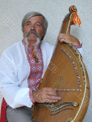 Senior ukrainian folk Kobzar with bandura