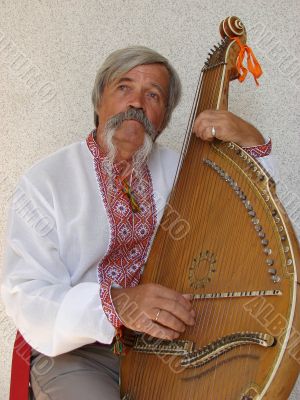 Senior ukrainian folk Kobzar with bandura