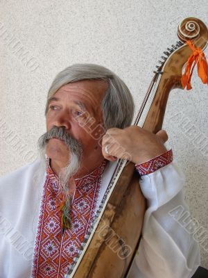 Senior ukrainian folk Kobzar with bandura