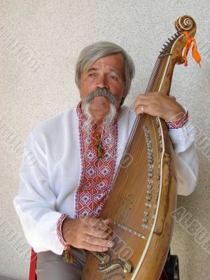 Senior ukrainian folk Kobzar with bandura