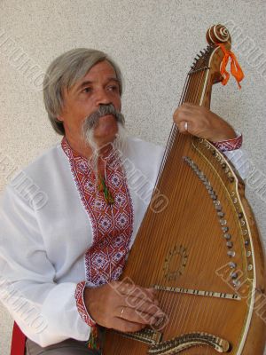 Senior ukrainian folk Kobzar with bandura