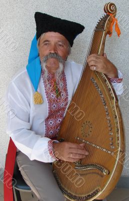 Senior ukrainian folk Kobzar with bandura