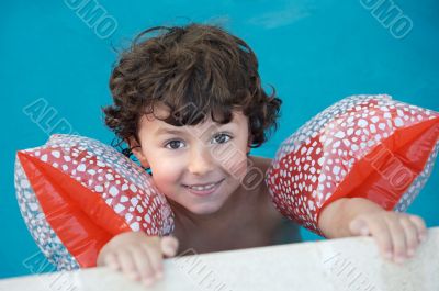 boy learning to swim