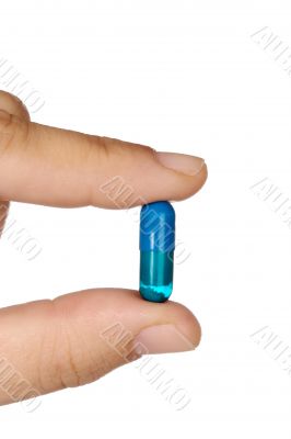 hand with a pill