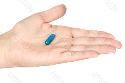 Hand with a pill