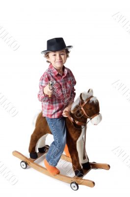 adorable kid riding a toy horse