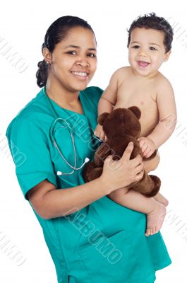 Adorable doctor with a baby in her arms