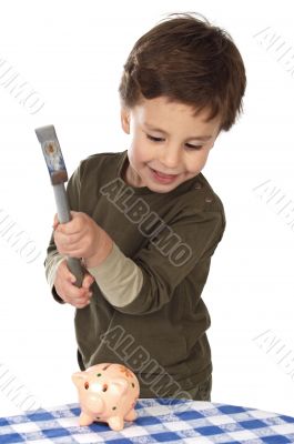 adorable boy breaking the money box adorable boy breaking the money box
