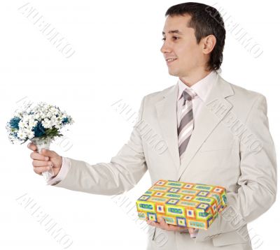 Attractive young man giving a love gift Attractive young man giving a love gift