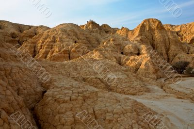 Arid earth over the blue sky