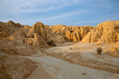 Arid earth over the blue sky