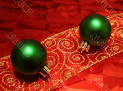 Two Green Balls on a Ribbon