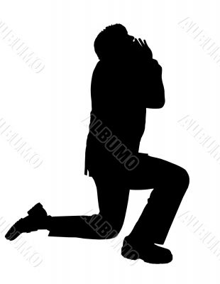business man praying silhouette